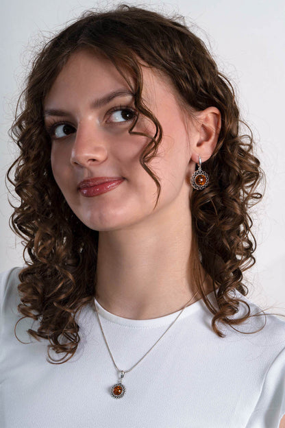 Srebrne duże ażurowe kolczyki z bursztynem